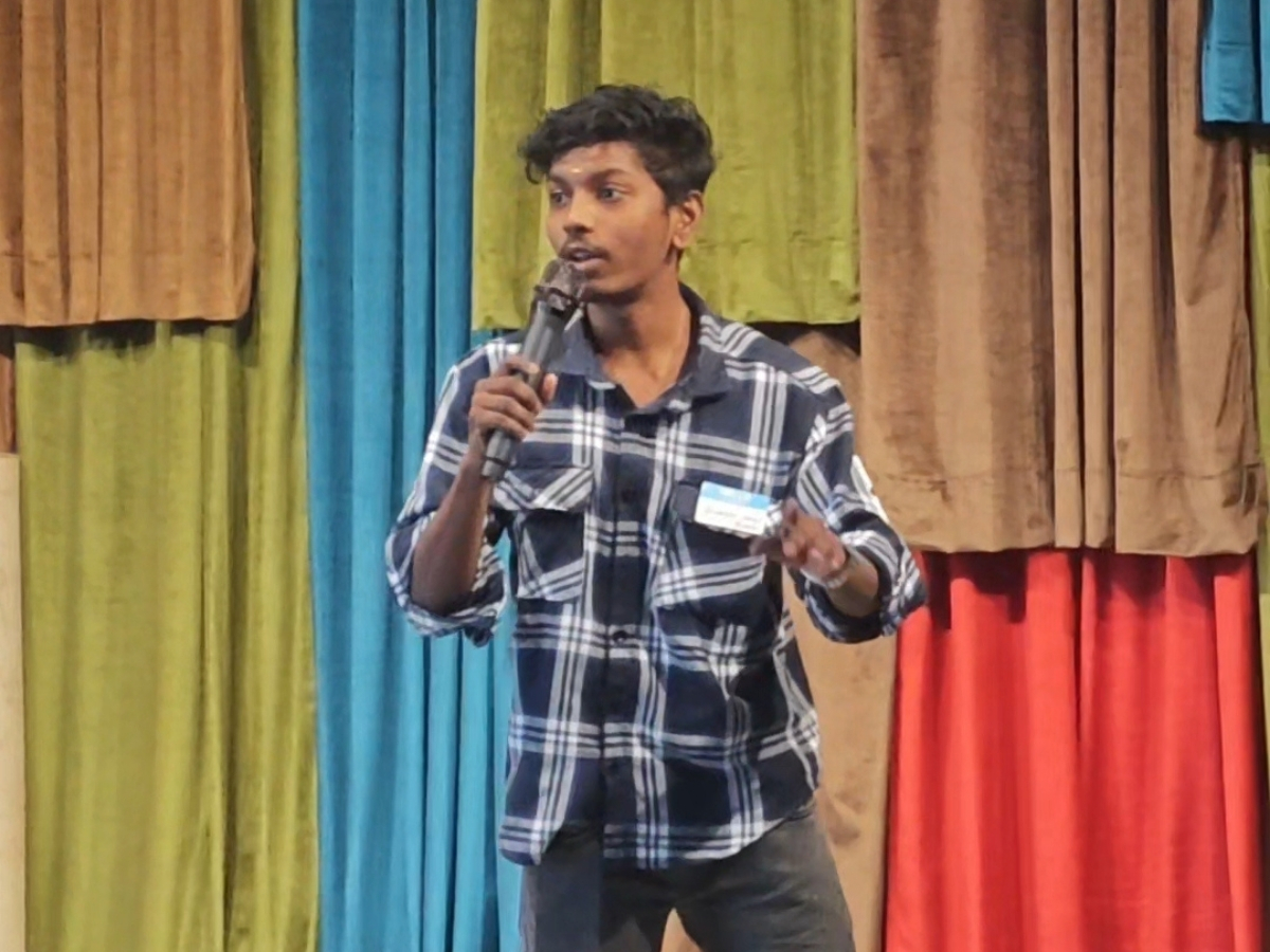 Boobesh AG speaking at a Chennai tech event
